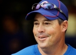 Former Chicago Cubs pitcher Greg Maddux, who is now the assistant to the Cubs general manager, watches practice during spring training baseball camp Saturday, Feb. 20, 2010, in Mesa, Ariz. (AP Photo/Ross D. Franklin)