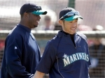 Seattle Mariners teammates Ken Griffey, Jr., left, and Ichiro Suzuki, right, of Japan, walk off the practice field after taking batting practice while working out at the team's baseball spring training facility Tuesday, Feb. 23, 2010, in Peoria, Ariz.