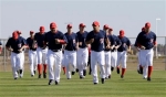 Members of the Washington Nationals loosen up by running during spring training baseball practice, Sunday, Feb. 21, 2010, in Viera, Fla.