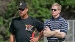Neal Huntington (right) Pirates' GM and the team's manager John Russell (left) watch the players at practice at the team's training facility . Associated Press/ Chris Wilcox .........