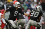 Jason Campbell (8) hands the ball off to Darren McFadden (20) of the Oakland Raiders against the Kansas City Chiefs during an NFL game at Oakland-Alameda County Coliseum on November 7, 2010 in Oakland, California. Photo by Jed Jacobsohn/Getty Images