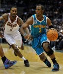 Milwaukee Bucks' Brandon Jennings, left, guards New Orleans Hornets' Chris Paul, right, who drives to the basket during the first half of an NBA basketball game Saturday, Nov. 6, 2010, in Milwaukee. AP Photo/Jim Prisching )