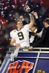 New Orleans Saints quarterback Drew Brees (9) holds the Vince Lombardi Trophy after the Saints win 31-17 against the Indianapolis Colts at Super Bowl XLIV at Sun Life Stadium in Miami Gardens, Florida on February 7, 2010. Ben Liebenberg/NFL.com .......