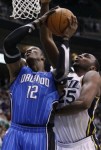Orlando Magic center Dwight Howard (12) attempts to score as Utah Jazz center Al Jefferson (25) defends during the first half of an NBA basketball game in Salt Lake City, Friday, Dec. 10, 2010. AP Photo/Colin E Braley .......