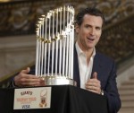San Francisco Mayor Gavin Newsom makes a playful grab for the San Francisco Giants world championship trophy before an announcement of a trophy tour at City Hall in San Francisco, Wednesday, Dec. 15, 2010. The tour will begin on Jan. 4, with stops in California, Oregon, Nevada, New York City, Arizona and Cooperstown, N.Y. AP Photo .......