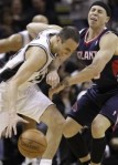 San Antonio Spurs' Manu Ginobili, left, of Argentina, is defended by Atlanta Hawks' Mike Bibby, right, during the third quarter of an NBA basketball game, Friday, Dec. 10, 2010, in San Antonio. AP Photo/Eric Gay ....