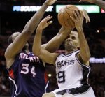 San Antonio Spurs' Tony Parker (9), of France, is fouled by Atlanta Hawks' Jason Collins (34) during the second quarter of an NBA basketball game, Friday, Dec. 10, 2010, in San Antonio. AP Photo/Eric Gay ........